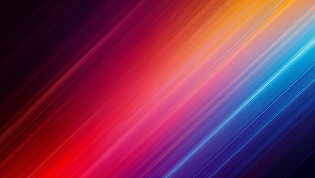 Diagonal neon light streaks gradient background featuring vibrant prismatic color motion