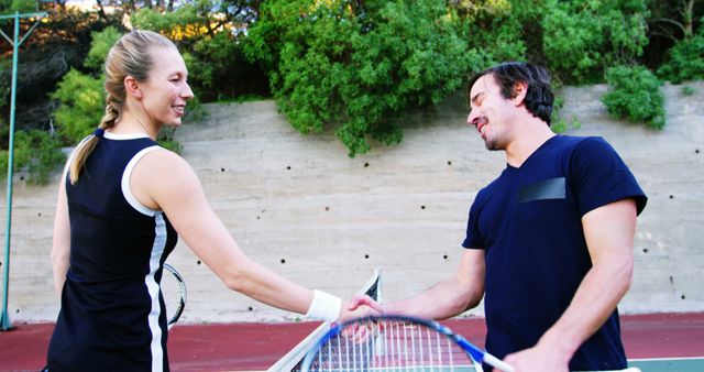 Friendly Tennis Interaction Between Opponents Shaking Hands After Match - Download Free Stock Images Pikwizard.com