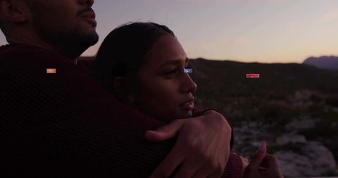 Embracing Couple Overlooking Serene Valley at Sunset