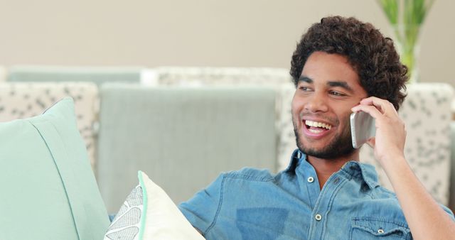 Happy Man Talking on Mobile Phone While Relaxing at Home - Download Free Stock Images Pikwizard.com