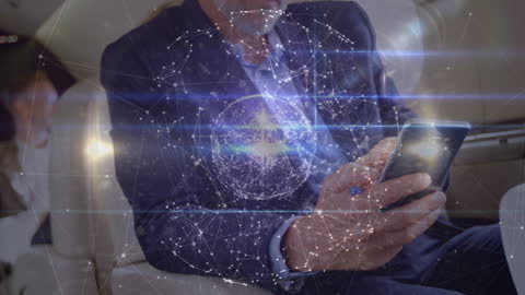 Businessman Interfaces with Global Digital Network on Smartphone