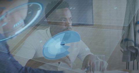 Collaborative team analyzing holographic analytics and charts during modern office meeting