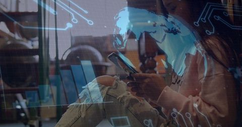 Young woman scrolling smartphone with holographic analytics overlays in coworking cafe