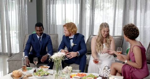 Wedding reception celebration with multiethnic friends toasting