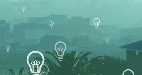 Abstract cityscape with floating light bulbs icons