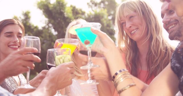 Friends Celebrating with Colorful Drinks Outdoors - Download Free Stock Images Pikwizard.com