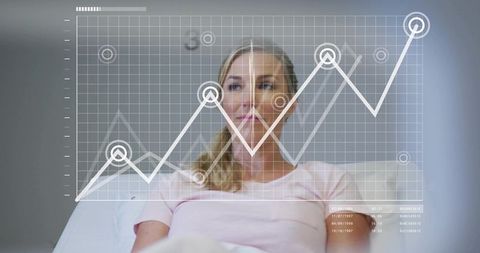 Mature woman analyzing digital finance dashboard with rising line graph overlay