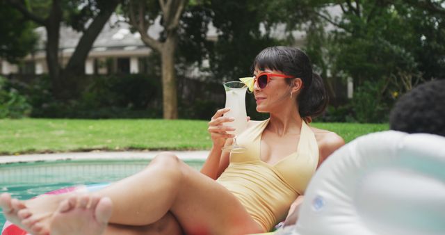 Woman Relaxing by Swimming Pool with Drink - Download Free Stock Images Pikwizard.com