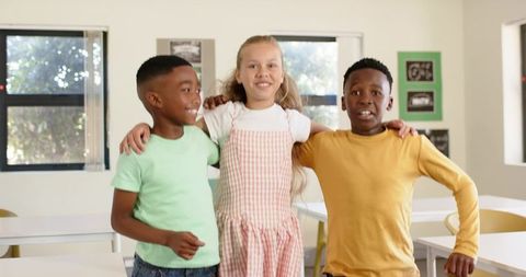Sunlit classroom friends posing together, diverse teens showing teamwork and inclusion