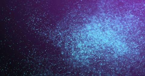 Glowing Blue Particles on Purple Background in Motion - Download Free Stock Images Pikwizard.com