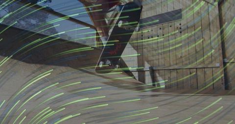 Male skateboarder jumping midair on wooden mini-ramp with neon green motion trails, dynamic action