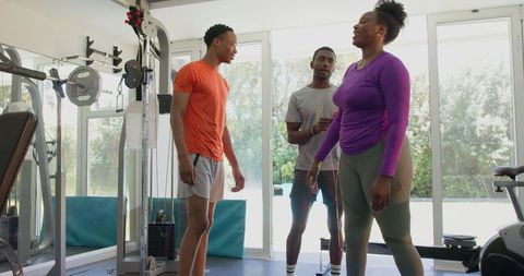 Group training session in modern gym with personal trainer