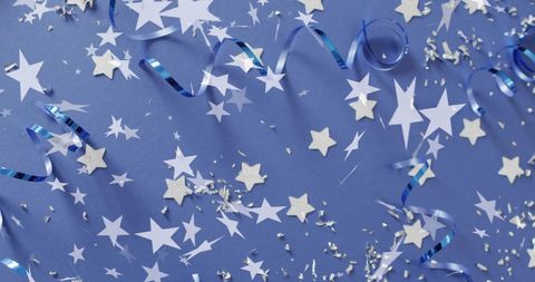 Festive Blue Background with Stars and Streamers for Celebrations