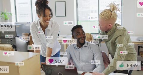 Diverse Team Collaborating with Social Media Overlays in Modern Office - Download Free Stock Images Pikwizard.com