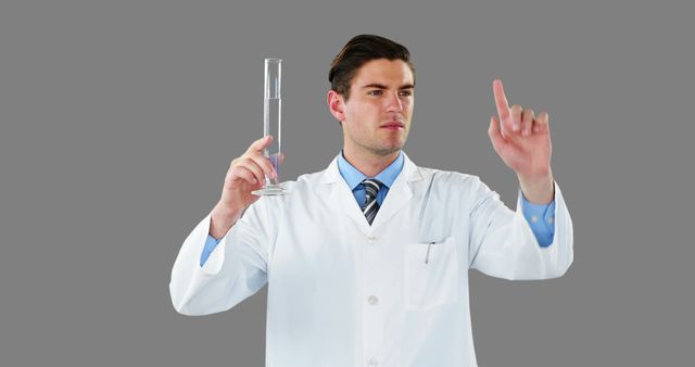 Male Scientist in Lab Coat Holding a Beaker and Gesture - Download Free Stock Images Pikwizard.com