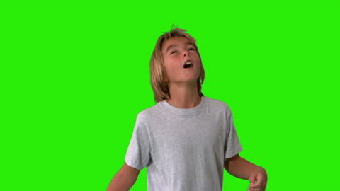 Young Boy Playing Football with Green Screen Background