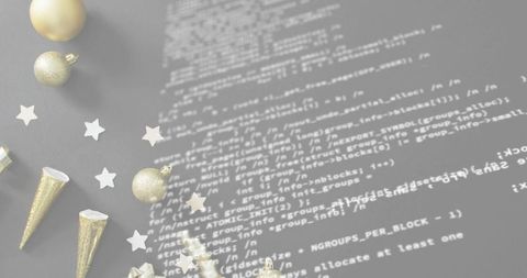 Blending festive gold ornaments with white code overlay for minimal tech holiday flatlay