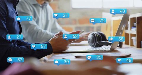 Boosting social media engagement in coworking office with laptop, smartphone notifications