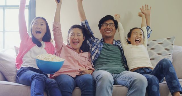 Excited Family Enjoying Movie Night on Couch - Download Free Stock Images Pikwizard.com