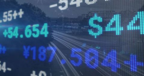 Digital currency ticker overlaying urban highway light trails displaying market data