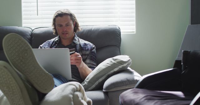 Man Shopping Online with Credit Card While Relaxing at Home - Download Free Stock Images Pikwizard.com