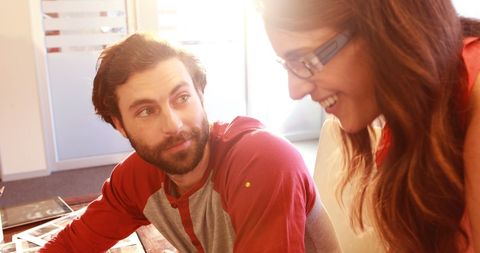 Graphic designers collaborating creatively in office space