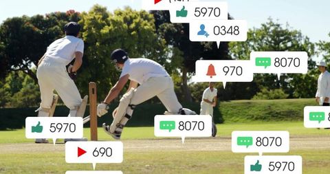 Cricket batsman diving to crease while wicketkeeper collecting ball in outdoor grass match