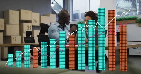 Business colleagues discussing sales growth with digital bar chart overlay in office