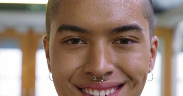 Close-up of Smiling Young Person with Nose Piercing - Download Free Stock Images Pikwizard.com