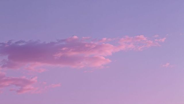 Pastel Pink Clouds Against Twilight Sky