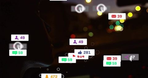 Silhouetted driver viewing augmented reality hud notifications on windshield at night