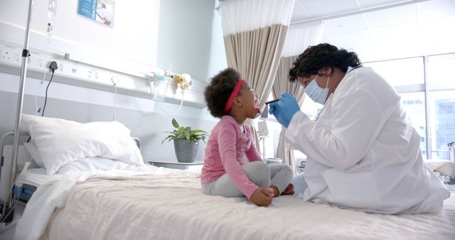 Doctor Examining Child's Throat in Hospital Room - Download Free Stock Images Pikwizard.com