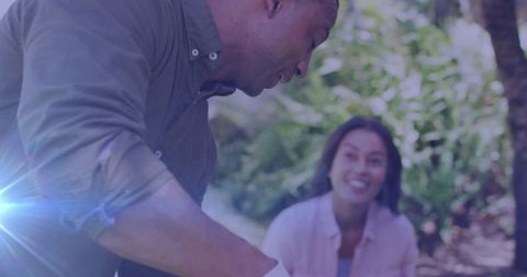 Happy Diverse Couple Gardening Together Outdoors