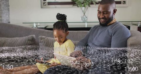Father and daughter using tablet on couch with digital data overlay, bonding and learning