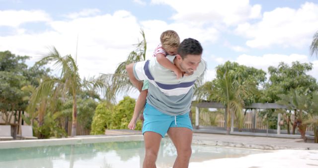 Father Giving Son Piggyback Ride Outdoors by Pool on Sunny Day - Download Free Stock Images Pikwizard.com