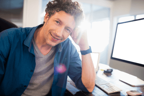 Transparent Businessman Smiling at Desk in Modern Office