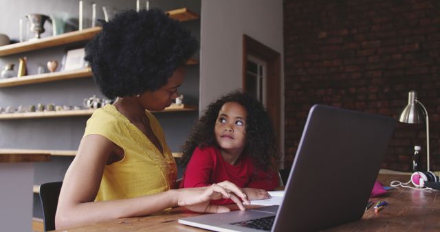 Mother Helping Daughter with Homework Table Near Laptop - Download Free Stock Images Pikwizard.com