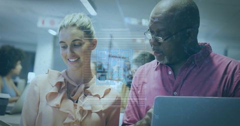 Diverse colleagues collaborating with digital interface visuals