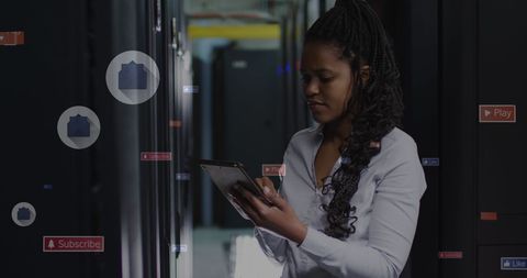 businesswoman managing servers with social media icons in dark room - Download Free Stock Images Pikwizard.com