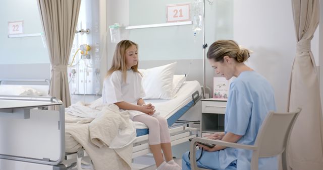 Young Female Patient Receiving Consultation from Healthcare Professional in Hospital Room - Download Free Stock Images Pikwizard.com