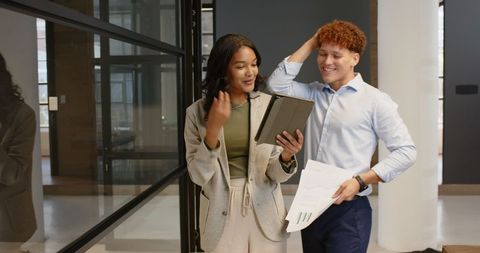 Diverse business professionals collaborating in modern office space