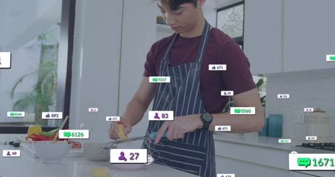Korean teen grating butter while live streaming cooking tutorial in modern kitchen