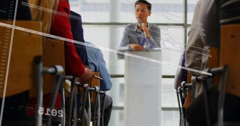 Business presentation speaker engaging with attentive audience