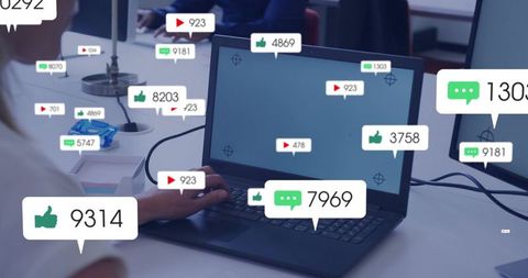 Laptop typing with social media engagement overlays showing likes comments and views