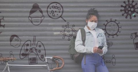 Woman in Mask Using Smartphone with Pandemic Graphics