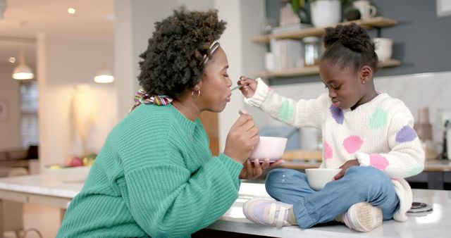 Mother and Daughter Bonding During Breakfast in Kitchen - Download Free Stock Images Pikwizard.com