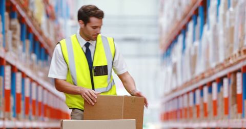 Warehouse Worker Handling Packages for Shipment - Download Free Stock Images Pikwizard.com