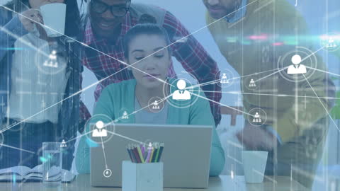 Connected Team Collaborating at Laptop