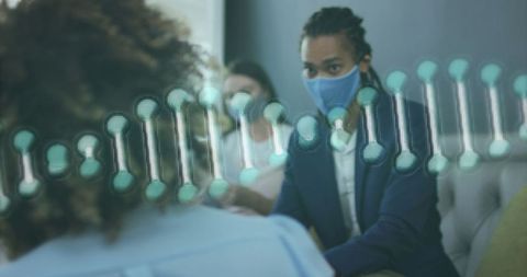 Businessman with DNA Strand Graphic During Pandemic Discussion