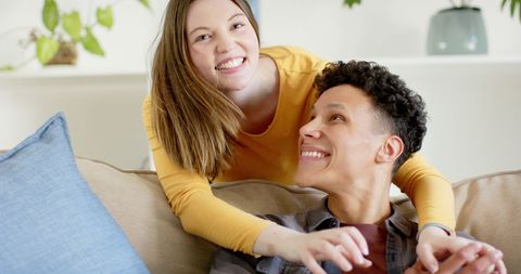 Happy Couple Relaxing and Smiling on Couch at Home - Download Free Stock Images Pikwizard.com
